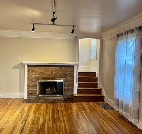 Living room with wood burning fireplace