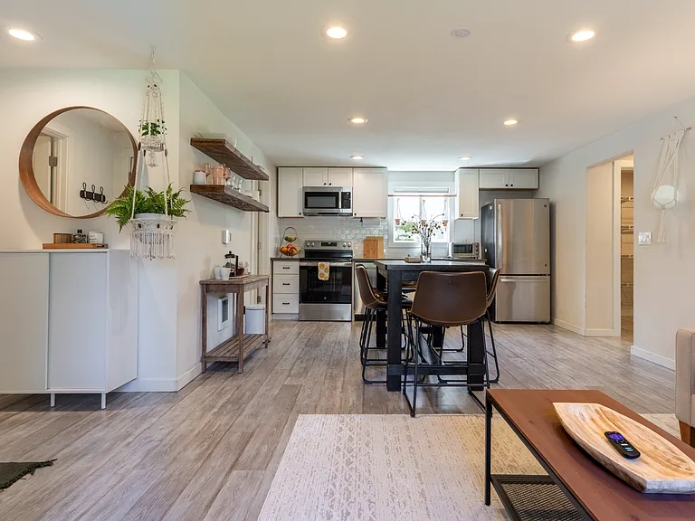 Open concept, dining area, open shelving, seats 6 ppl, view from living room
