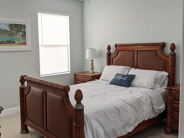Guest Bedroom with Queen-sized mattress & memory foam pillows.