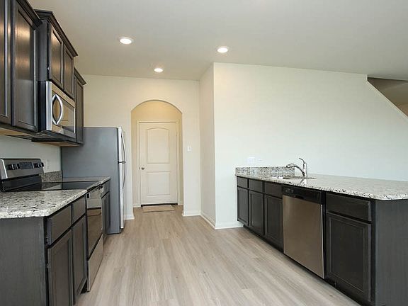 Enjoy abundant storage space and designer finishes in the Mesquite by LGI Homes.