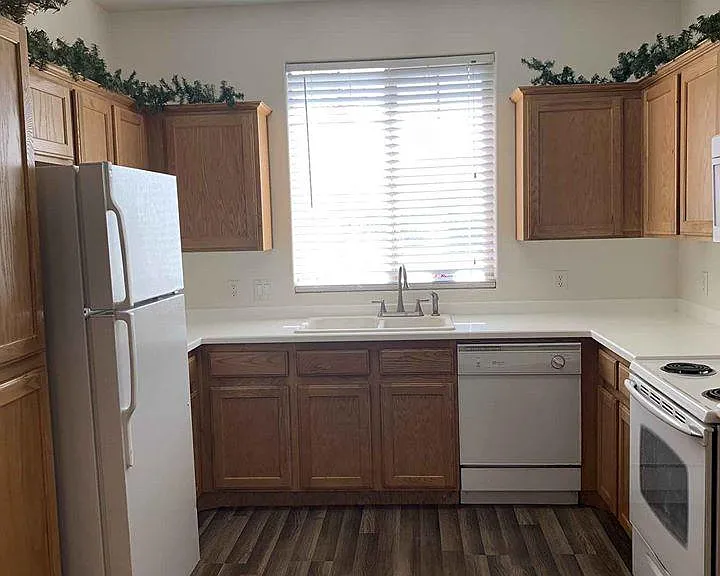 Kitchen with stove, fridge, microwave, dishwasher, garbage disposal
