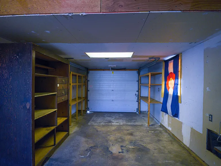 Inside of garage as you walk in. This is a pull up garage door, not automatic.