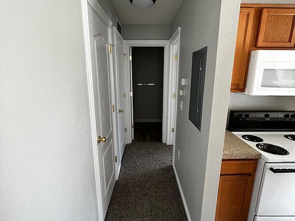 Hallway leading to downstairs bedroom, bathroom and laundry