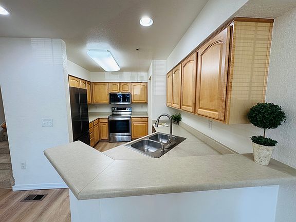 Light filled kitchen with new stainless steel appliances
