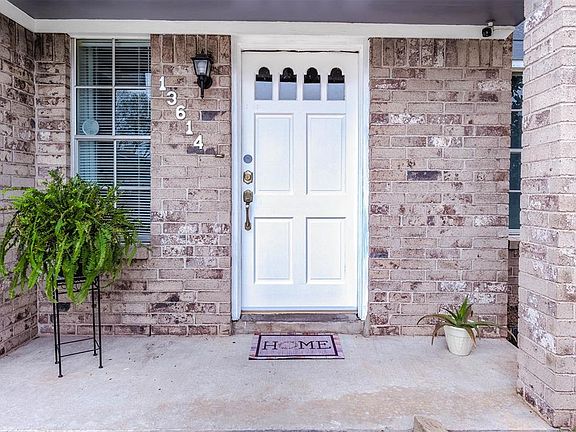 Approaching the front door you will see the beautiful brick elevation and covered front porch!