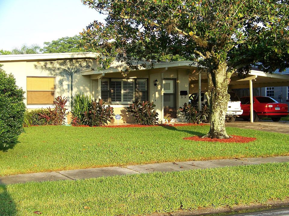 East facing front with large Magnolia tree