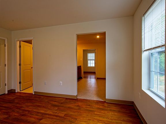 FRONT ROOM WITH 3 WINDOWS -- ACCESS TO BATHROOM