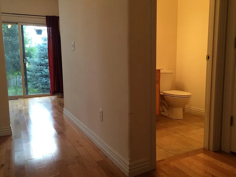 Lower Floor Powder Room Area/
Kitchen Door to Backyard