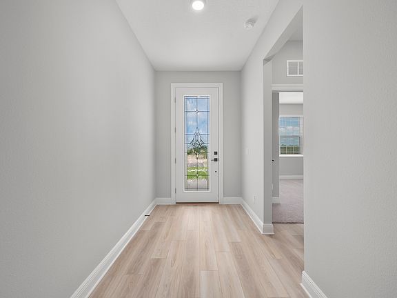 The entryway is highlighted by this gorgeous front door!