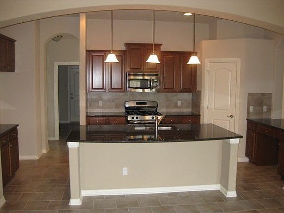 Decorative pendant lights over island bar