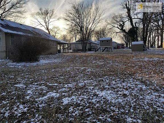 Large corner lot with playset and shed