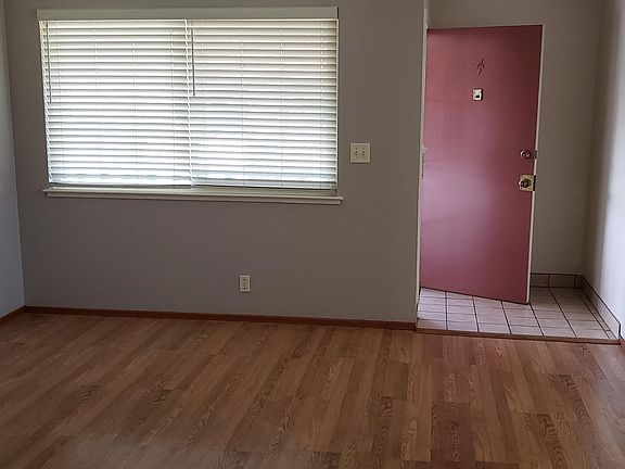 Front door entry to tiled foyer and spacious living room