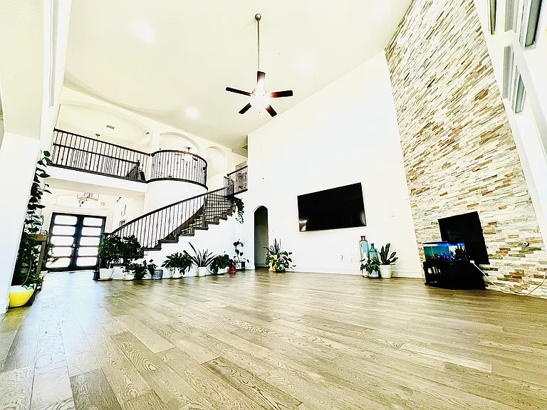 Graceful curved staircase leading from the living area