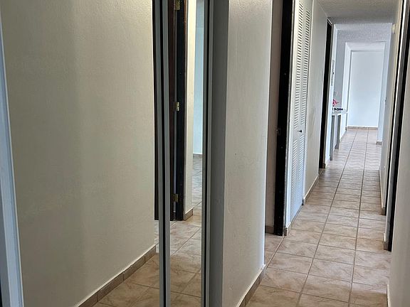 Hallway with closets
