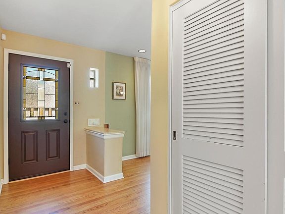 A beautiful front door lets in so much light and h