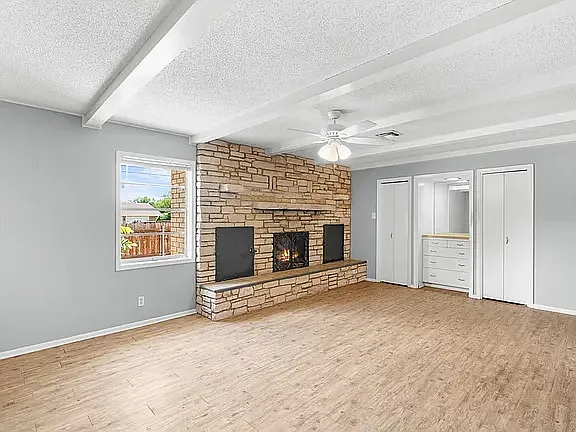 Very Large Third bedroom/Den/Game room with beamed ceiling, ceiling fan, two large closets and storage drawers