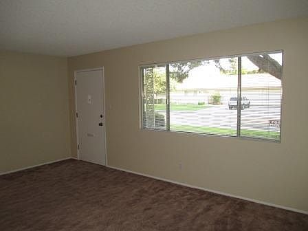Entry & family room. South facing window overlooks front yard.