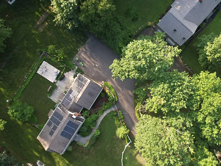 Areal view of the property, with view to the fenced backyard and deck