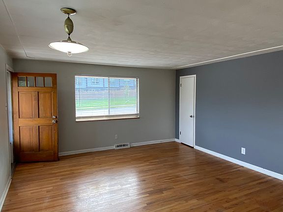 View to large coat closet and painted rear wall
