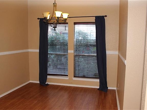 Formal Dining room with laminate wood flooring.