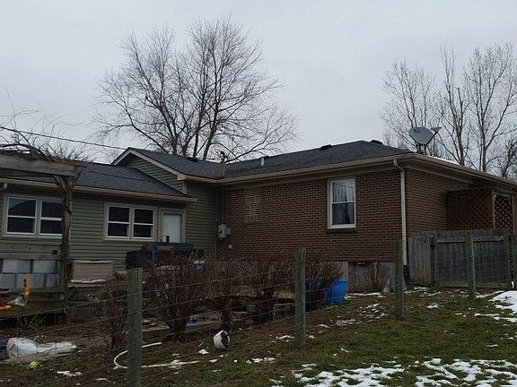 REAR OF HOME WITH LARGE DECK