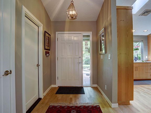 Foyer-exit to garage and clothes closet.
