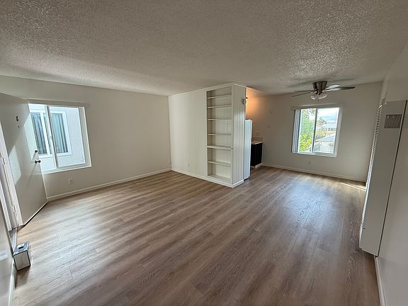 Living Room with built-in shelves and new flooring