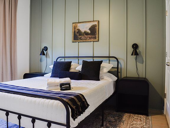 Queen Bedroom #2 w/ black out drapes and wall sconces