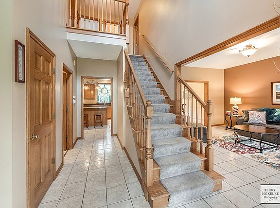The spacious 2 story foyer is so charming.