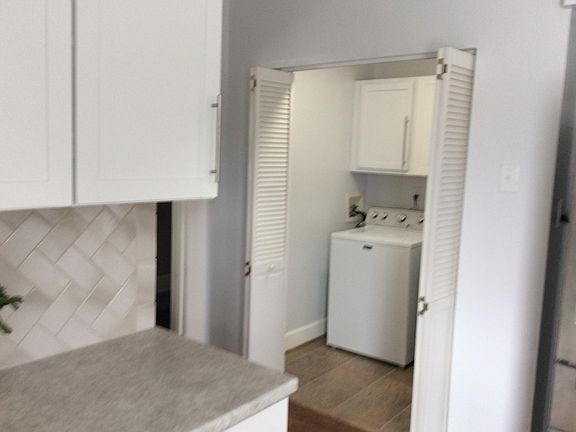 Laundry hook ups off kitchen