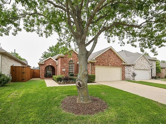 Large mature tree and beautiful landscaping.