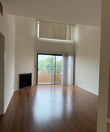 Living Area with high ceilings and balcony