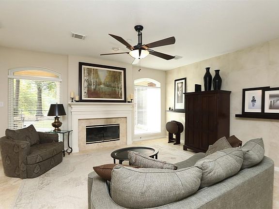 Travertine floors throughout most of downstairs! Family room over looks the lake!