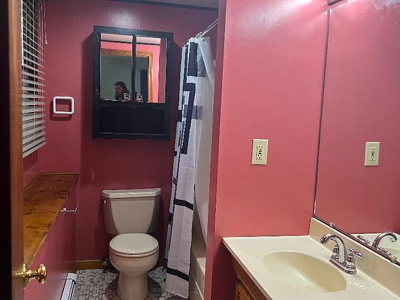 Bathroom with full tub.