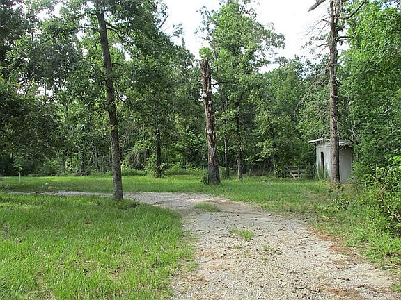 Surrounded by beautiful trees and lush, green vegetation.