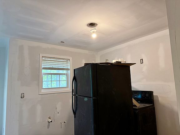This will be a kitchen again soon. These older appliances will be replaces with sparkling new ones.