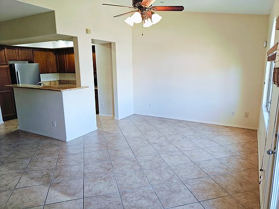 Spacious living area with high ceiling.