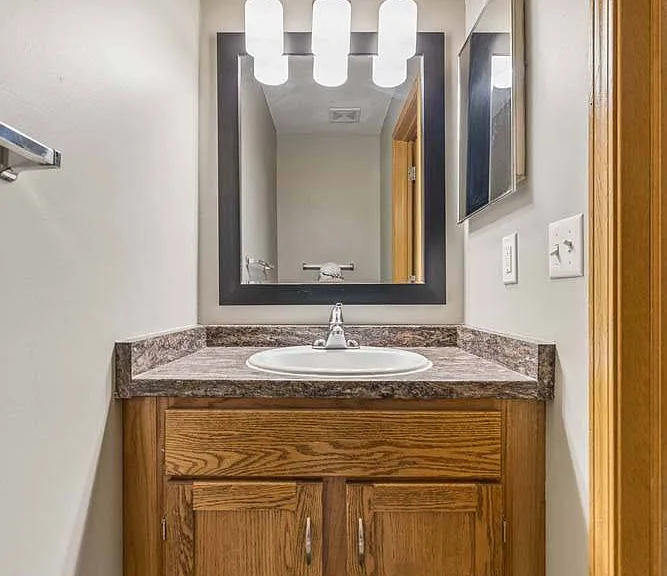A stylish vanity with modern lighting adds a polished touch to your daily routine.