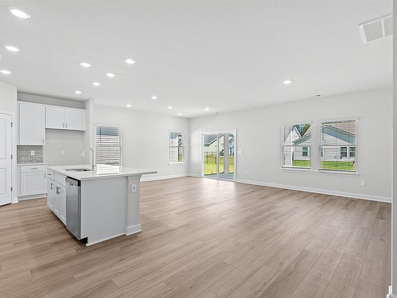 The kitchen overlooks the dining area and great room.