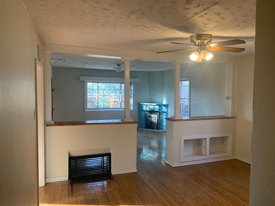 view of living room and fireplace from dining room