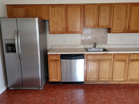 kitchen w/new refrigerator and stove