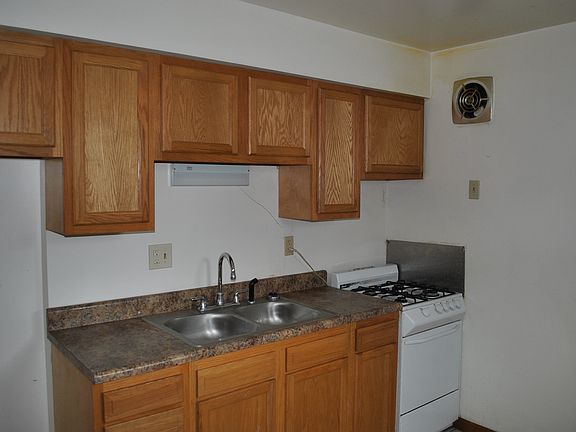 Updated eat-in kitchen with gas range and refrigerator included.