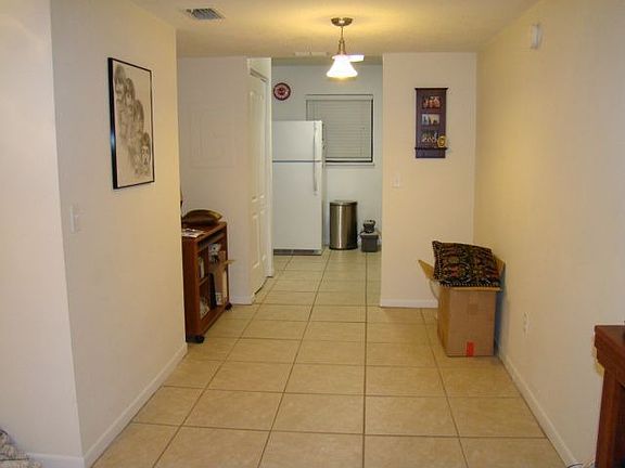Dining room area leading back into the kitchen