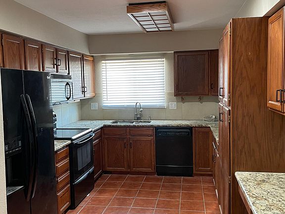 Large kitchen with tons of cabinet space for storage. Bonus cabinet pantry!