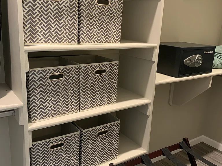 Plenty of organizing baskets, a programable safe and luggage stands.