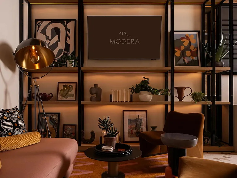 Layered lighting, curated art, and warm finishes create an inviting retreat inside Modera Rio Salado.