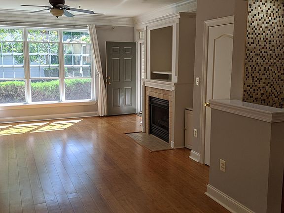 View of living room with lots of natural light (kitchen is on the right).