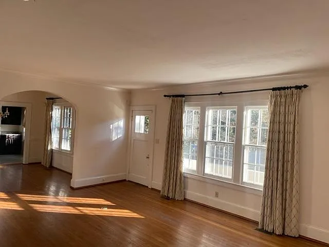 Beautiful view of living and dining rooms in the morning light (with insulated storm windows)