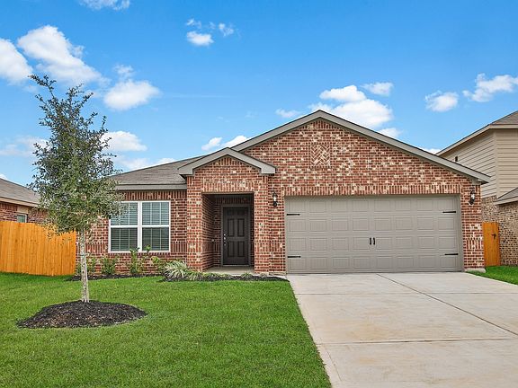This beautiful home has a brick exterior and front yard landscaping