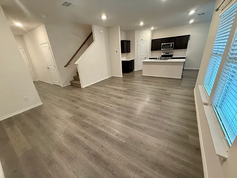 Living room, kitchen, and stairs